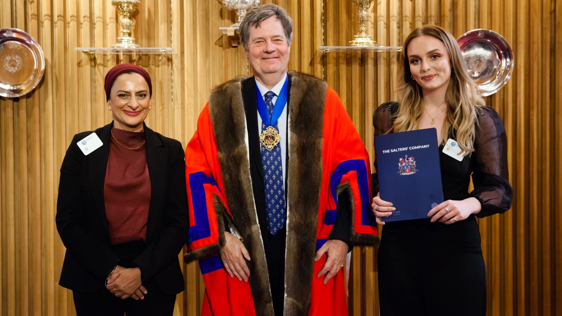 Emily Dixon receives the Graduate Award from Dr Rehana Sidat and Master Jamie Wordie.